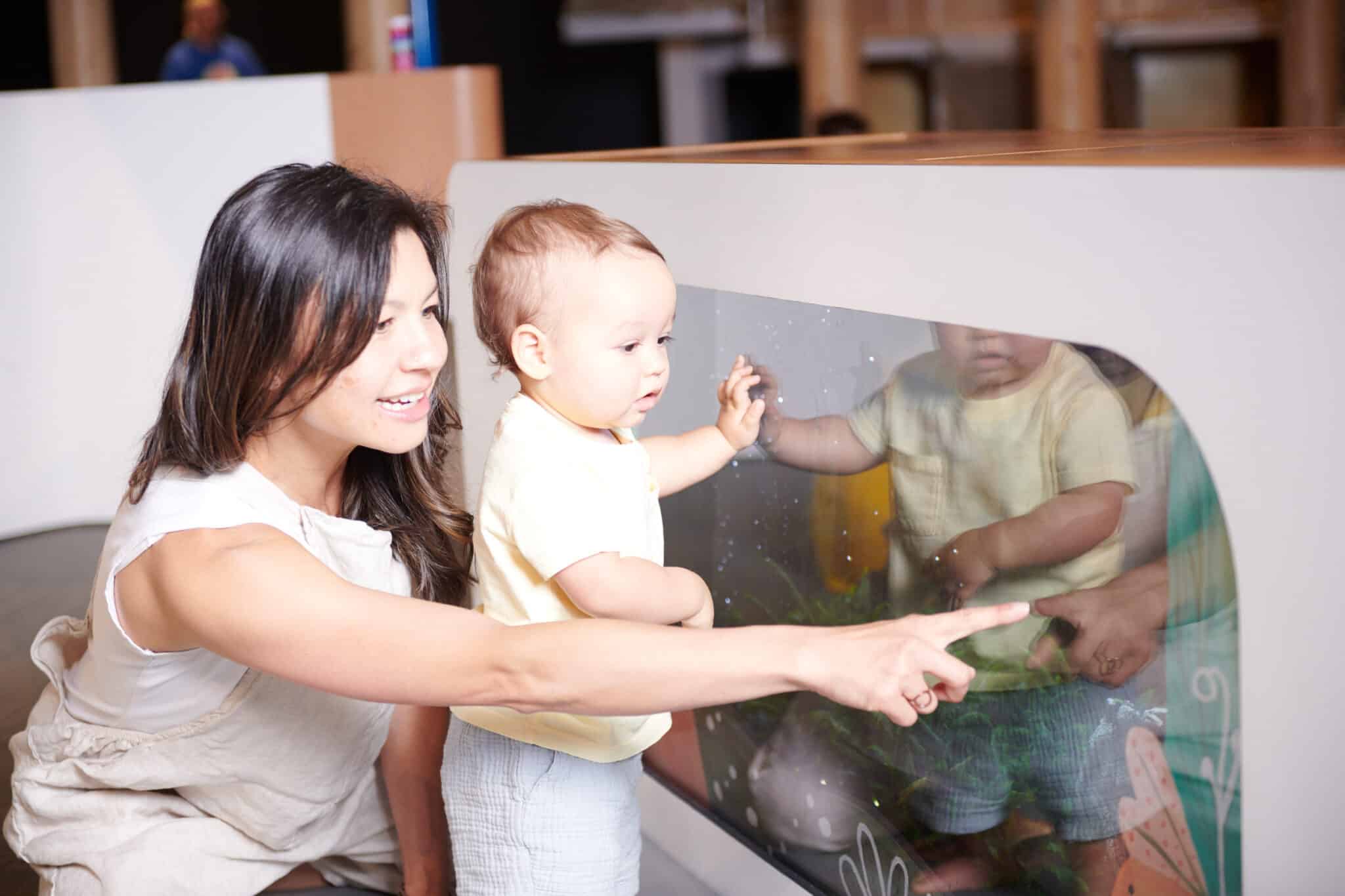Mother and baby exploring OMSI's Science Playground.