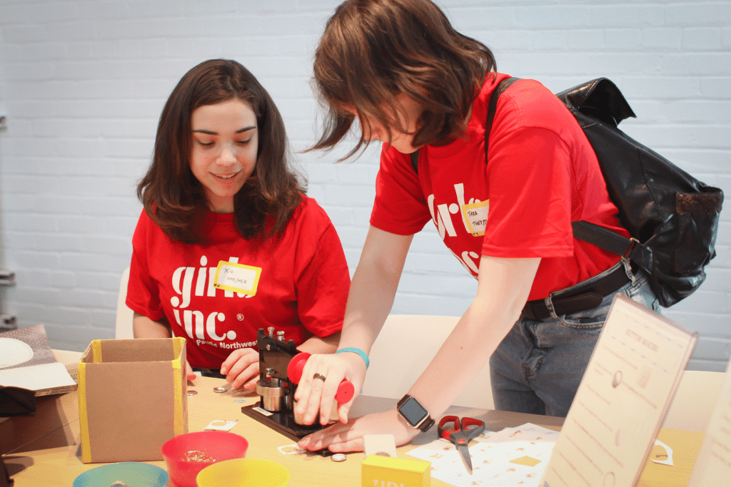 Two teens working on a craft project in The Mezz