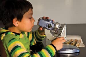 Student using a microscope.