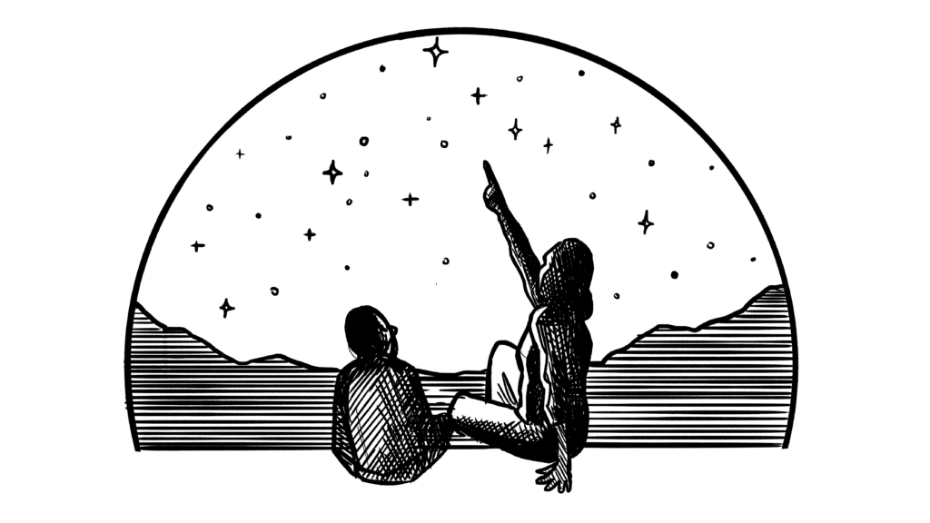 Parent and child looking up at the stars