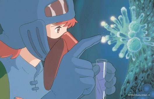 Still from Nausicaa of the Valley of the Wind where she is collecting spores in a vile