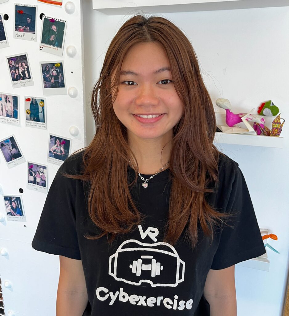 Photo of Teen Tech Center intern Ashley Tran wearing her Cybexercise T-shirt advertising the virtual reality program she built.