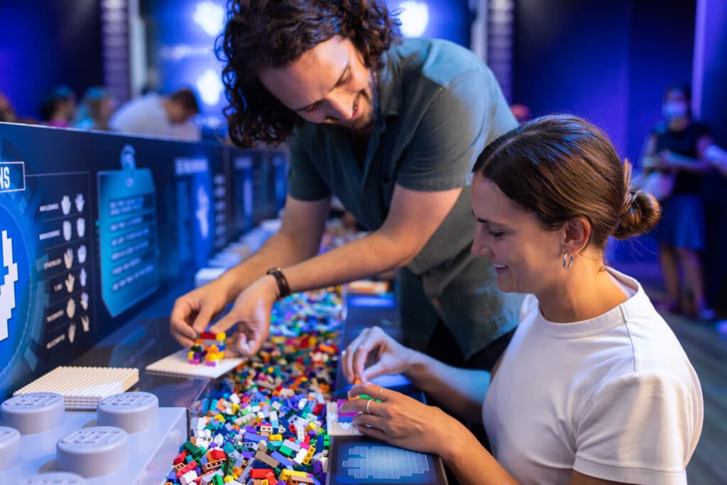 Couple building at LEGO building station