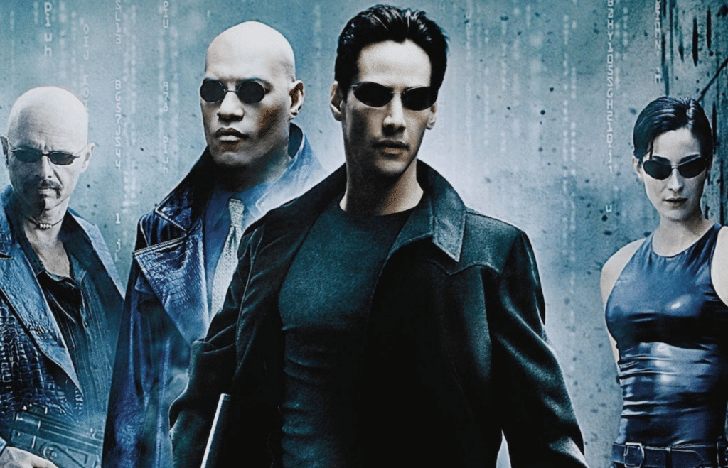 Four characters in dark clothing and sunglasses stand against a digital code backdrop, conveying a futuristic and intense atmosphere.