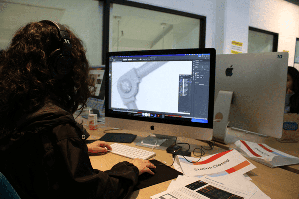 Teen building a 3D design on a computer in the Teen Tech Center