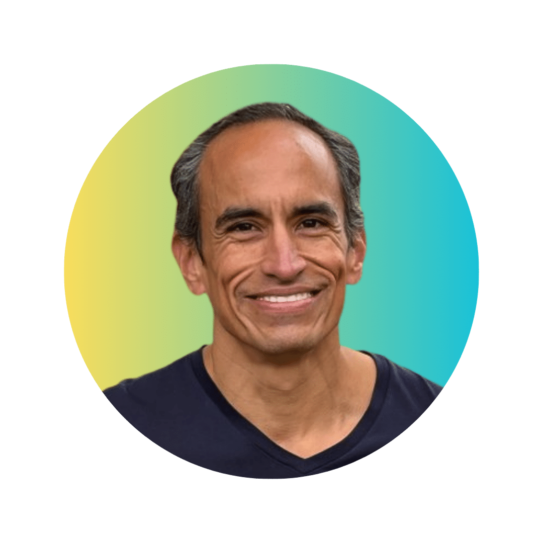 A headshot of Dorian Gualotunia, OMSI's Vice President of People and Culture. His headshot is on a background gradient from yellow to light blue