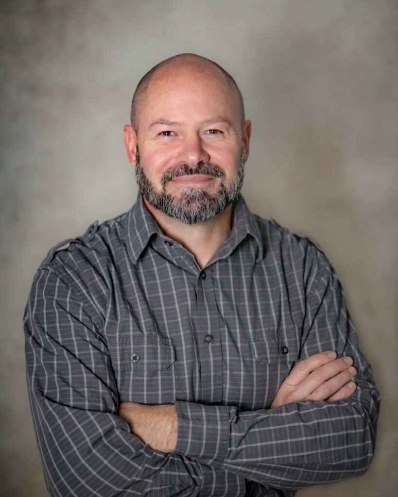 A headshot of Joshua Clark