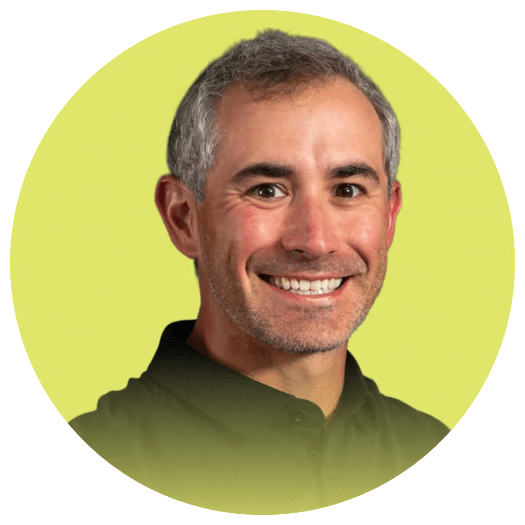 Aj Alley's headshot for the OMSI Board of Trustee's page. He is set in a yellow circle with a slight gradient on the bottom of it